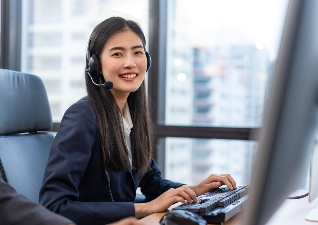 Happy smiling operator asian woman customer service agent with h | I.T MSP | I.T MSP Happy smiling operator asian woman customer service agent with h
