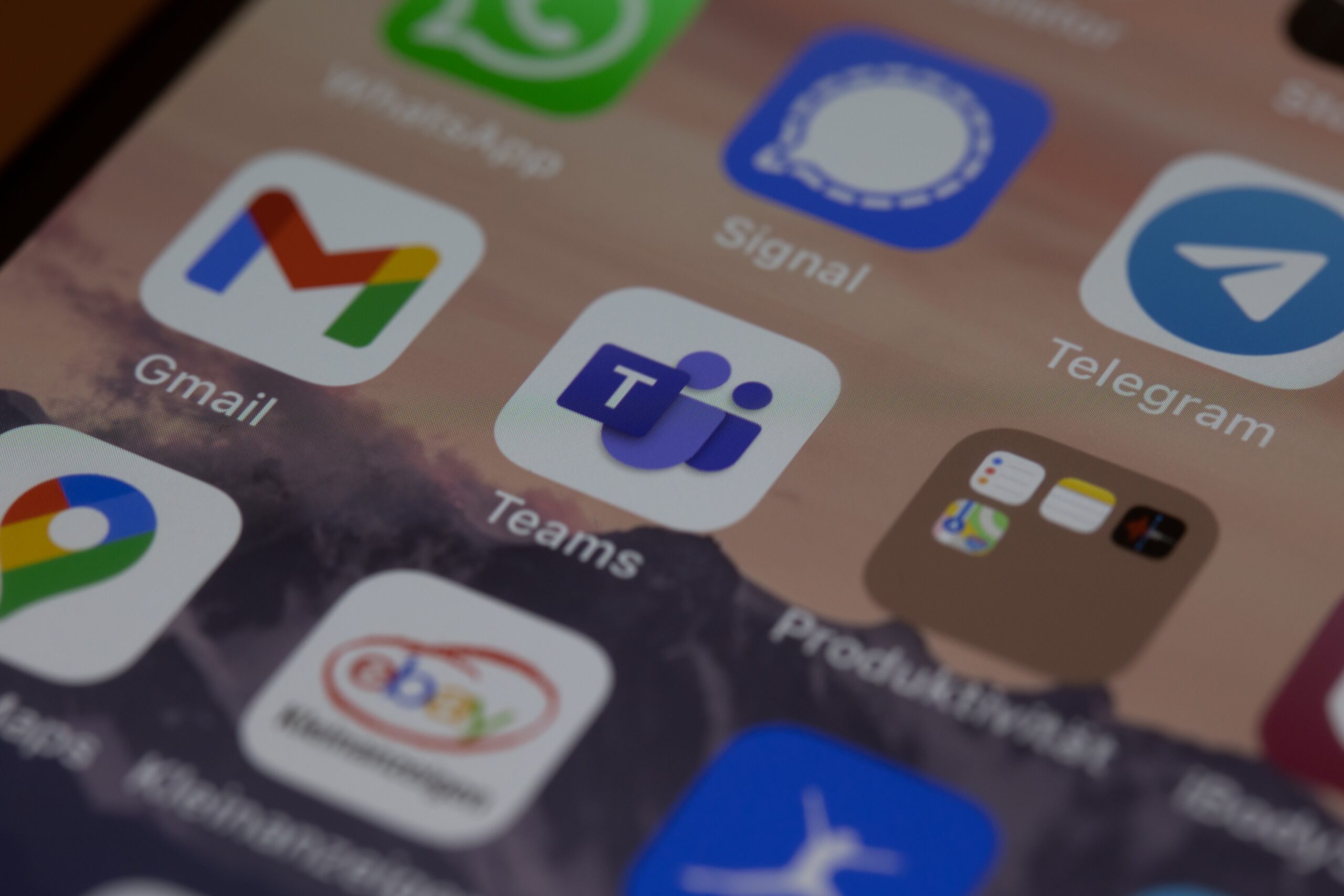 How-Can-You-Leverage-the-New-MS-Teams-Payment-App_-scaledjpg • Managed IT Services and Cybersecurity Provider in Singapore. iphone screen with icons on screen