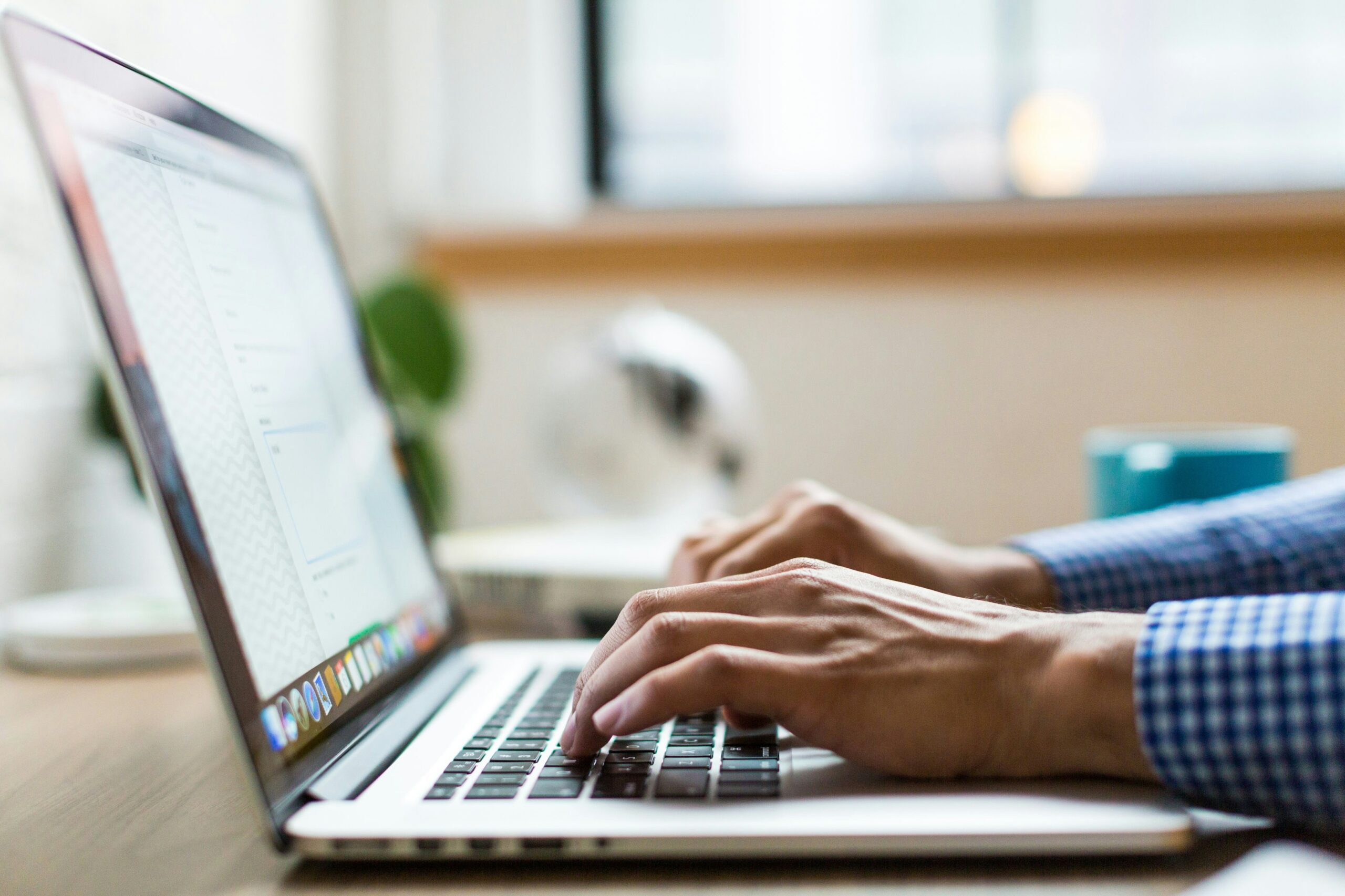 Is-Your-Business-Losing-Money-Because-Employees-Cant-Use-Tech-scaledjpg • Managed IT Services and Cybersecurity Provider in Singapore. person typing on silver Macbook