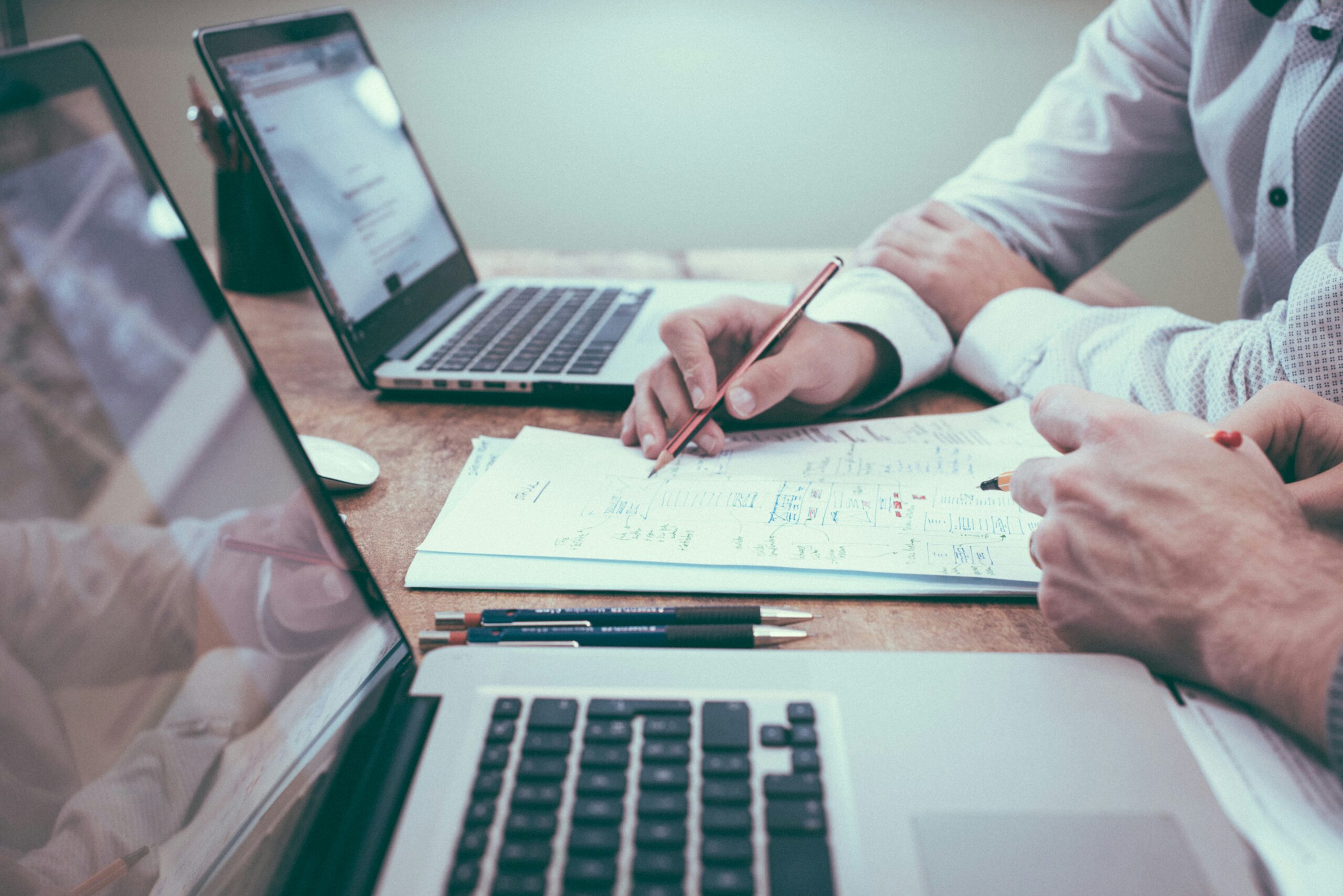 scott-graham-5fNmWej4tAA-unsplash-scaledjpg • Managed IT Services and Cybersecurity Provider in Singapore. person holding a pencil near laptop