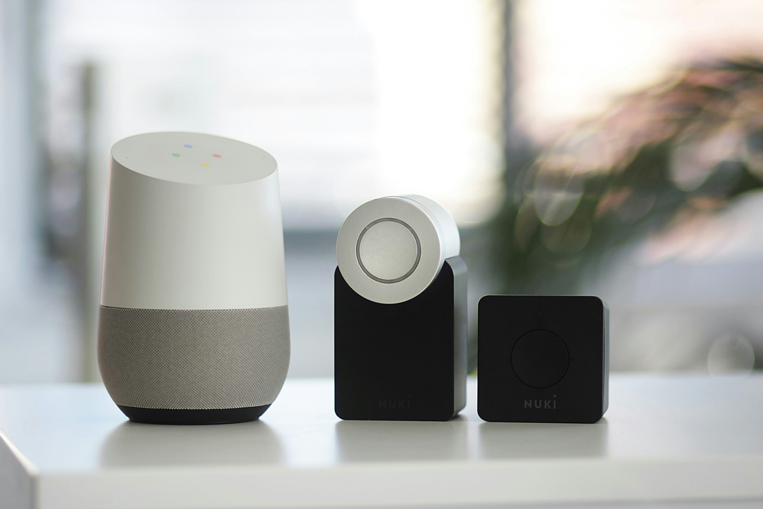 sebastian-scholz-nuki-Fh3Dtg6QX4Q-unsplash-scaledjpg • Managed IT Services and Cybersecurity Provider in Singapore. white and gray Google smart speaker and wo black speakers