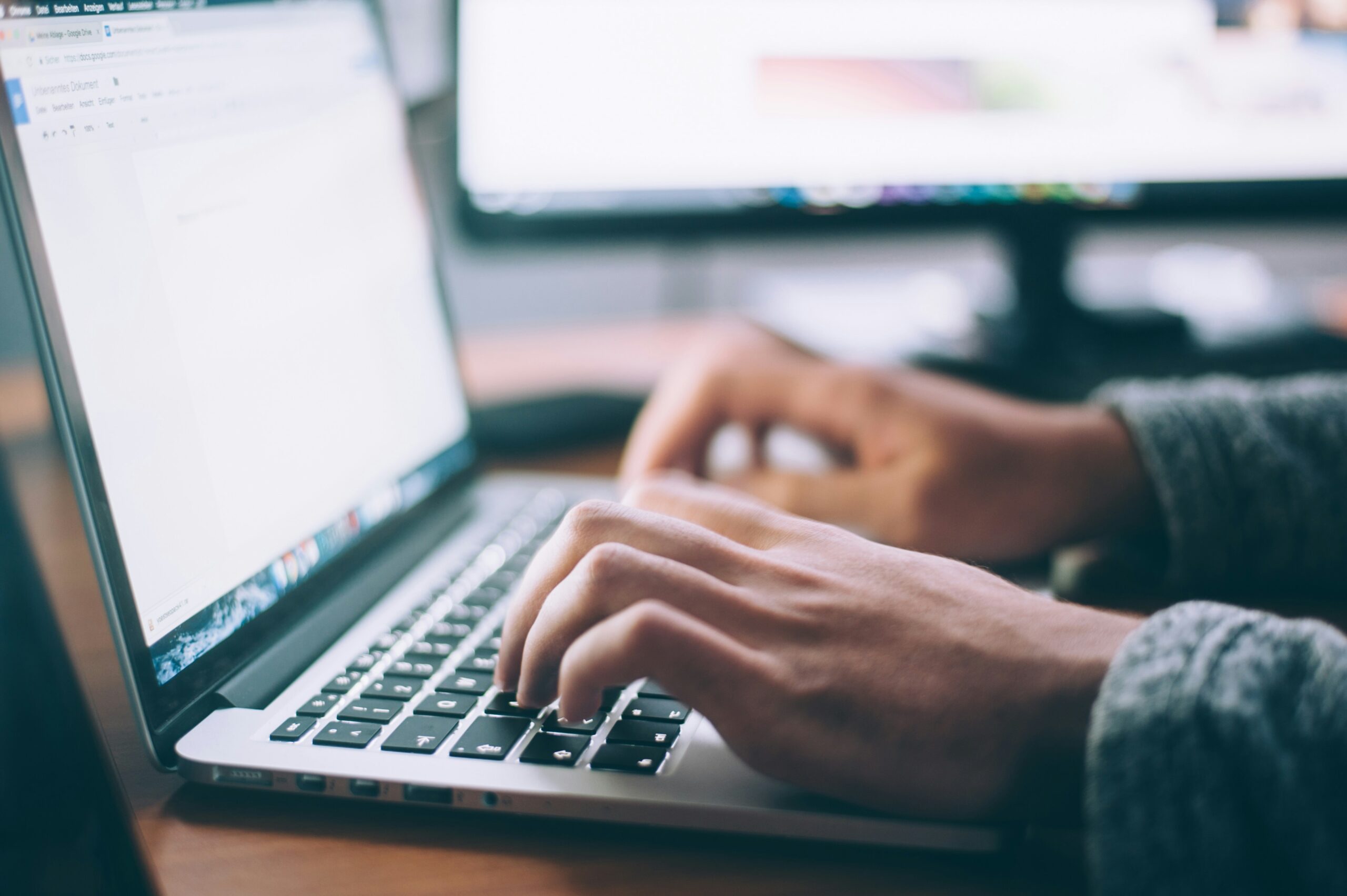 Essential-Settings-to-Maximize-Your-Microsoft-365-Experience-scaledjpg • Managed IT Services and Cybersecurity Provider in Singapore. Person using Macbook Pro