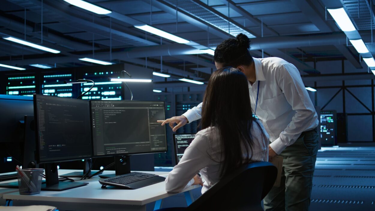 Computer scientists in data center managing and maintaining databases • Managed IT Services and Cybersecurity Provider in Singapore. Cybersecurity Consultants