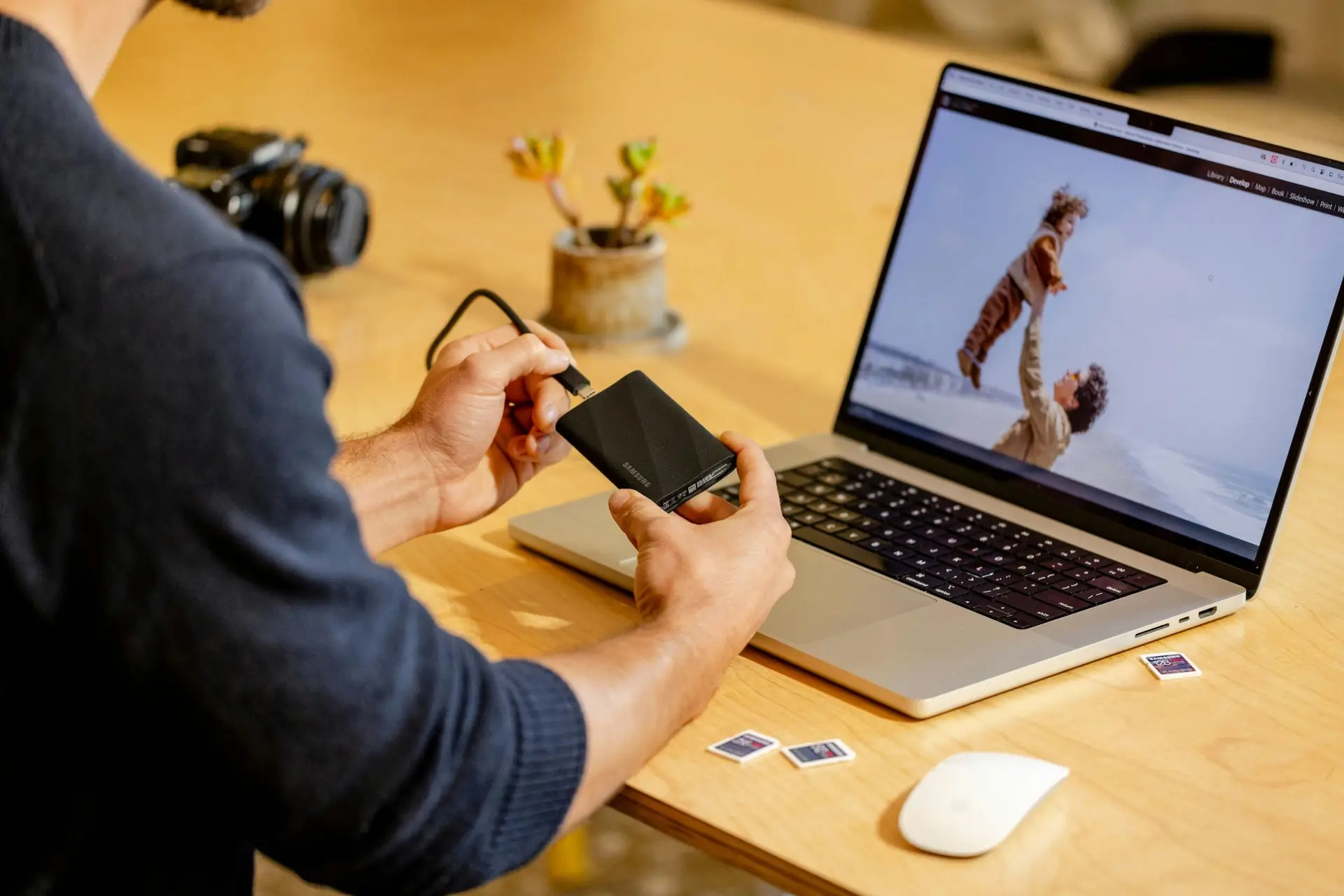 The-_Backup-Exit_-Strategy_-Can-You-Move-Your-Data-Without-the-Vendors-Help_-scaledjpg | Managed IT Services and Cybersecurity Provider in Singapore A man sitting at a table with a laptop and cell phone